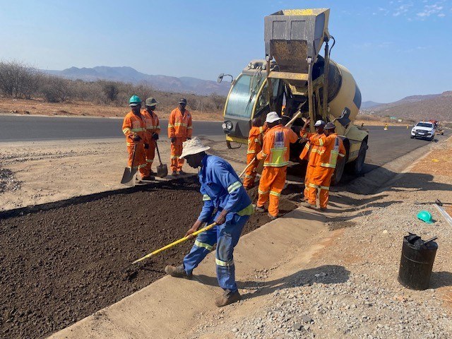 MEL Engineering roadworks crew laying asphalt